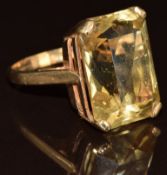 A 9ct gold ring set with an emerald mixed cut citrine, 6.9g, size P