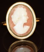 An 18ct gold ring set with a cameo of a young woman, 4.2g, size P