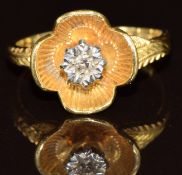 A 18ct gold ring set with a diamond in a flower setting, 3.1g, size J
