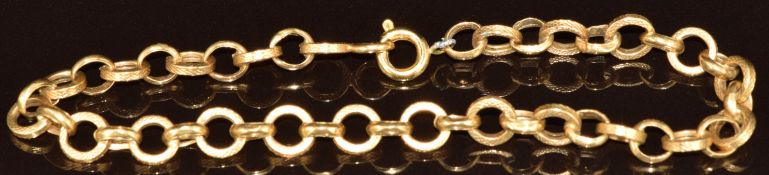 An 18ct gold bracelet made up of circular links with textured decoration, 4.7g, 19.5cm
