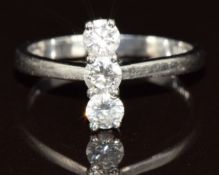 A platinum ring set with three round cut diamonds totalling approximately 0.4ct, 2.9g, size H