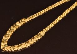 A 21ct gold necklace made up of chevron shaped links, 32.7g, 44cm