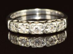 A 9ct white gold ring set with five diamonds, 2.2g, size J