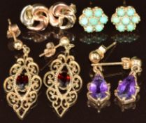 Four pairs of 9ct gold earrings comprising amethysts, turquoise, garnet and a tri-coloured pair, 6.