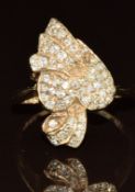 A 9ct gold ring set with diamonds in a heart and ribbon decoration, 5.8g, size P