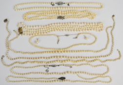 Nine cultured pearl necklaces, four with silver clasps and three without clasps