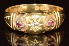 An 18ct gold ring set with a diamond and rubies, Chester 1912, 2.5g, size S