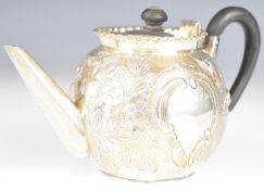 Victorian hallmarked silver bullet shaped teapot with embossed decoration and frilled rim,