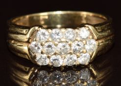A yellow metal ring set with diamonds in three rows (tests as 9k gold), 4g, size N