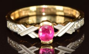 An 18ct gold ring set with an oval cut synthetic ruby and paste, 2.7g, size O