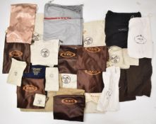 A collection of dust bags including Hermès, Prada, etc and an Hermès box