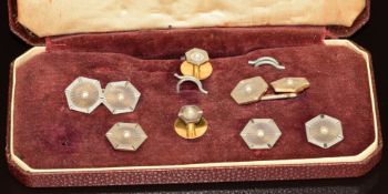 A pair of 18ct gold cufflinks set with carved agate and pearls with a platinum finish, with two