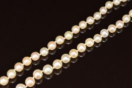 A single strand of cultured pearls with white metal clasp set with diamonds, 27.5g, 58cm