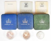 Three cased Royal Mint proof silver crowns comprising 1972 and two 1977, all with paperwork