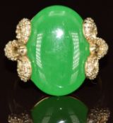 A 9k gold ring set with a dyed quartz cabochon and diamonds to the shoulders, 6.4g, size O