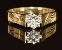 A 9ct gold ring set with a diamond in an illusion setting, 2g, size K
