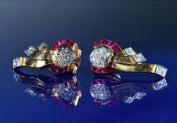 Art Deco pair of 18ct gold clip earrings set with eleven round cut diamonds and seven calibre cut