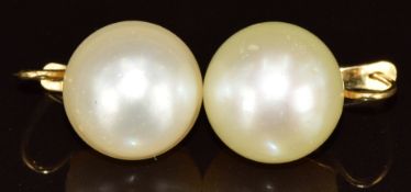 A pair of yellow metal earrings each set with a mabe pearl, 10.6g, 13.8mm