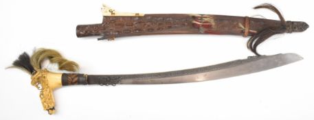 19th century Dayak Borneo headhunter's Mandau sword with engraved 53cm curved blade and carved