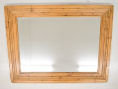 Large bevelled glass mirror with stepped pine frame, 105cm x 136cm