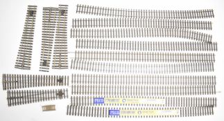 Fifteen Peco Streamline 0 gauge model railway track lengths and points.