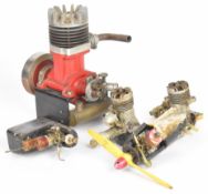 Five model internal combustion engines comprising a large 2 stroke example, height 20cm, two Enya