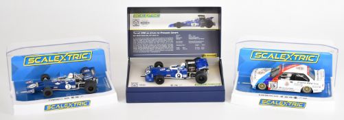 Three Scalextric 1:32 scale motor racing slot cars comprising Tyrrell 001 Jackie Stewart, Legends