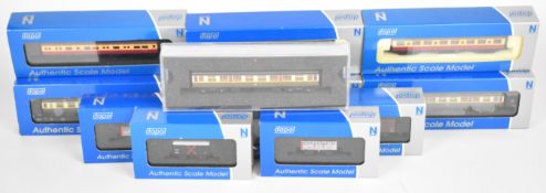 Twelve Dapol N gauge model railway coaches and goods wagons to include BR and GWR examples, all in