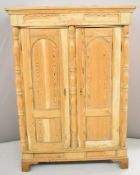 Continental antique pine housekeeper's or similar cupboard with twin doors flanking a turned central