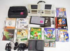 Two Nintendo DS handheld game consoles together with eleven DS and Game Boy Advance games, carry