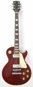 Gibson Les Paul Deluxe electric guitar in burgundy finish with rosewood fretboard, pearlescent