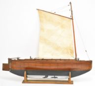 Tern model sailing boat with planked oak or similar hull, lead keel and covered cargo hold with