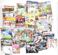 Forty Lego minifigure and small build polybags to include Star Wars, Harry Potter, Friends, Super