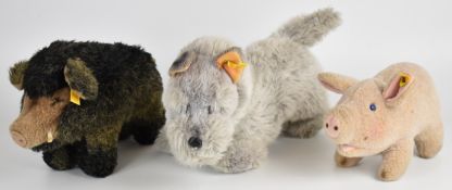 Three Steiff plush animals comprising Terrier Dog, Boar and Pig, all with yellow tags and button