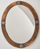 Arts and Crafts copper mirror with applied roundel decoration, 71 X 54cm