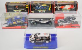 Seven Scalextric 1:32 scale F1 and Rally slot cars comprising Ford XR2i Repsol, Mini Countryman WRC,