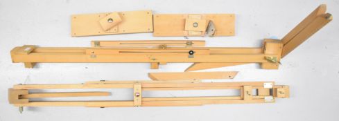 Pair of folding wooden artist's easels with adjustable height, one believed complete