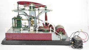 Live steam model of a beam engine with fluted connecting rod, driving a spoked flywheel, water