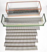 Two 0 gauge model railway locomotive glass display cases, largest 64 x 14.5 x 15cm, together with