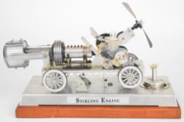 Stirling engine instructional toy cart, having meths burner with levers to engage drive to wheels,
