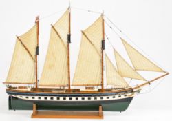 Ocean Trader model three masted sailing ship with wooden hull and deck details including tender