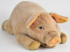 Steiff pig soft toy with original button and tag to ear, length 44cm.