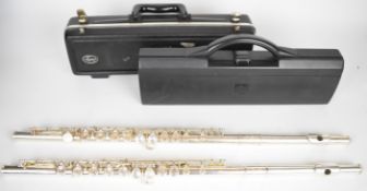 Two silver plated flutes by Buffet Crompton and Selmer, both in fitted cases.