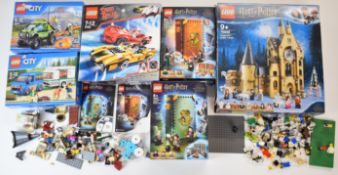 A collection of loose and part built Lego sets and minifigures to include Harry Potter, Star Wars,