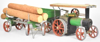Mamod TE1A live steam traction engine, together with a four wheel twin axle trailer and a lumber