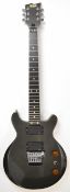 Vintage ESP double cutaway electric guitar in dark green finish with ebony fretboard, pearlescent