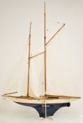Two masted sailing yacht with working rudder, faux planked deck, brass and copper fittings and