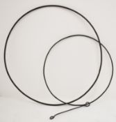 Two Victorian or later wrought iron toy hoops with handles, largest diameter 83cm