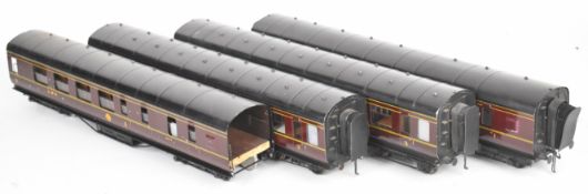 Four Exley 0 gauge model railway LMS 3rd class corridor coaches.