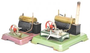 Two Fleischmann live steam engines, both with single oscillating cylinder, one on raised plinth with